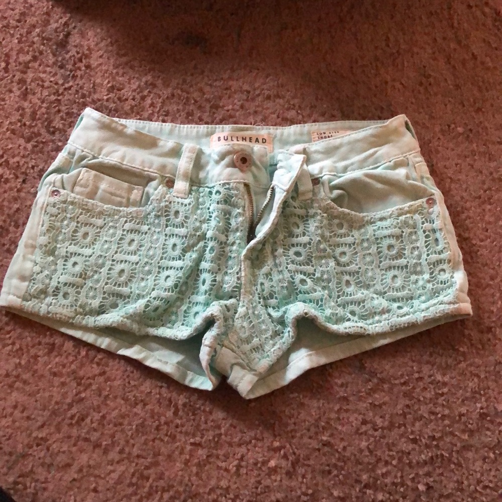 Teal jean shorts.